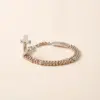 Rosenkranz Armband Rosalet in Rosegold und Silber mit Kristallbesatz und geöffneten Kreuz.