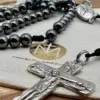Glänzende Hämatit-Perlen mit geknüpfter Kordel und silbernem Kruzifix des Rosenkranzes Gottes Liebe