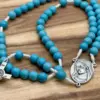 Mittelstück mit der Madonna von Medjugorje und türkisfarbene Perlen